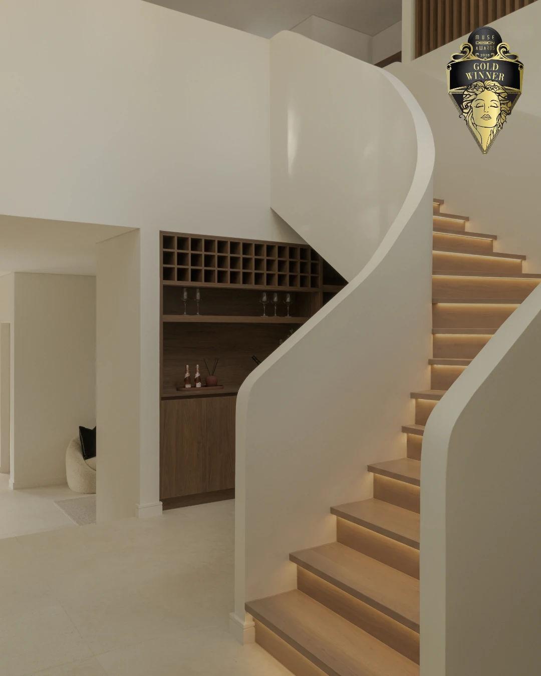 Curved stair and warm timber detailing at Elia House